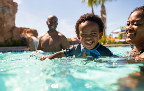 Family in the pool at Disney's Riviera Resort
